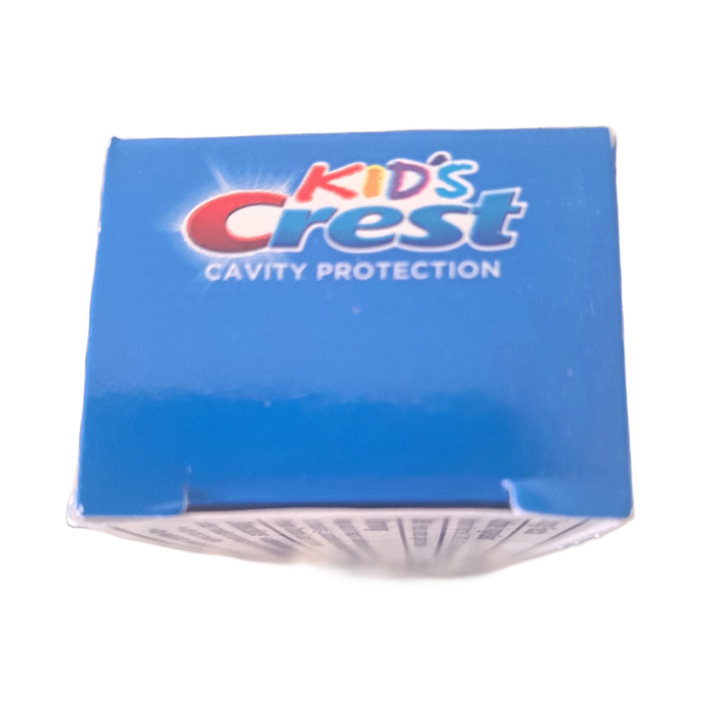Box of Kids' Crest cavity protection on a white background